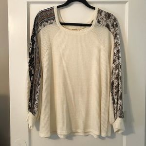 Pattern sleeves cream colored top